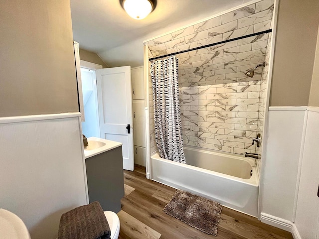 554 Laurel St, Chillicothe, OH 45601 - full bath with wood finished floors, shower / tub combo, wainscoting, vanity, and lofted ceiling