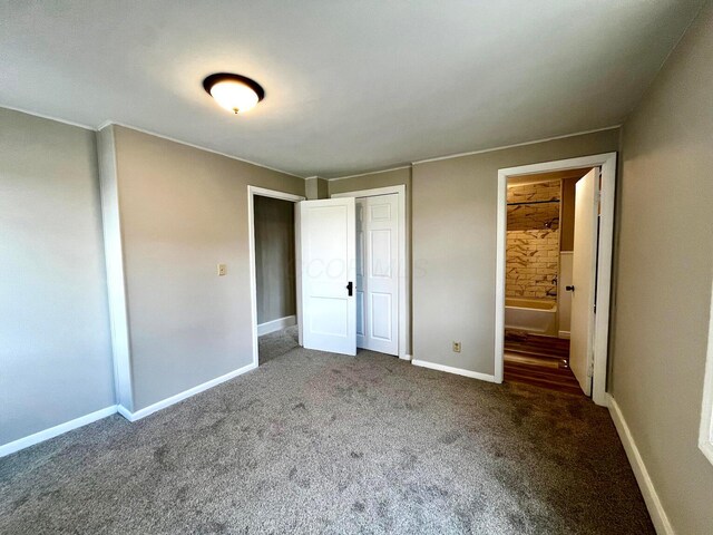 554 Laurel St, Chillicothe, OH 45601 - unfurnished bedroom featuring carpet floors, a closet, and connected bathroom