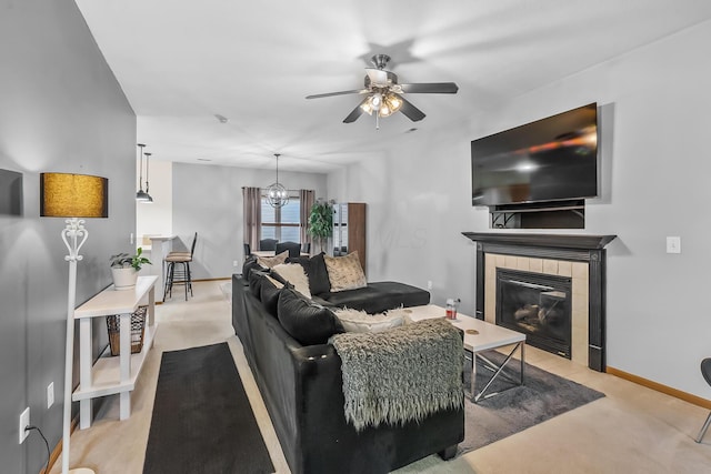 861 Summerville Dr, Delaware, OH 43015 - carpeted living room with ceiling fan, a tile fireplace, and a chandelier