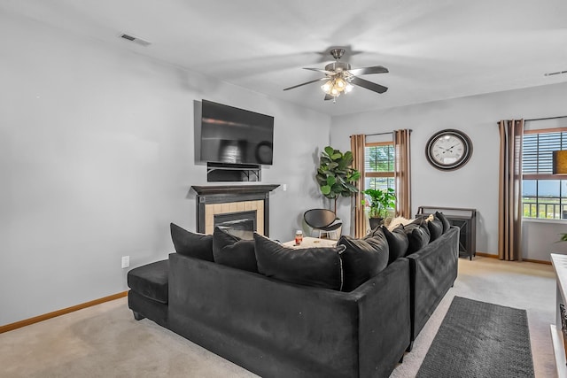 861 Summerville Dr, Delaware, OH 43015 - living area featuring light colored carpet, a ceiling fan, and a tiled fireplace