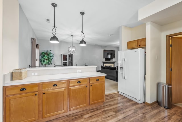 861 Summerville Dr, Delaware, OH 43015 - kitchen with white fridge with ice dispenser, a peninsula, light wood-style flooring, and light countertops
