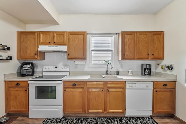 861 Summerville Dr, Delaware, OH 43015 - kitchen with white appliances, under cabinet range hood, dark wood-style floors, tasteful backsplash, and light countertops