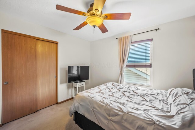 861 Summerville Dr, Delaware, OH 43015 - bedroom featuring light colored carpet, a closet, and ceiling fan