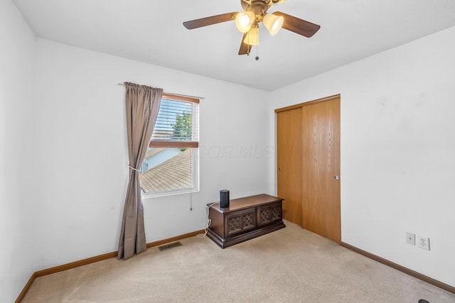 861 Summerville Dr, Delaware, OH 43015 - unfurnished bedroom with light colored carpet, a closet, and ceiling fan