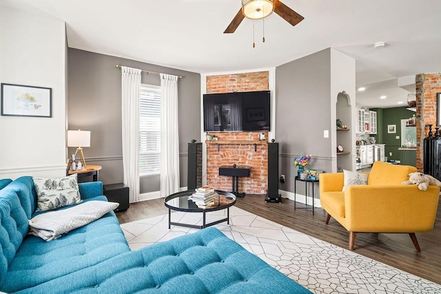 112 Oak Hill Ave, Delaware, OH 43015 - living room featuring ceiling fan, wood finished floors, a brick fireplace, and recessed lighting