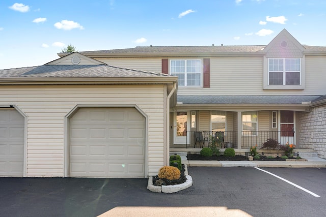 1814 Bennigan Dr Unit 88B, Hilliard, OH 43026 - view of front of home featuring covered porch and a shingled roof