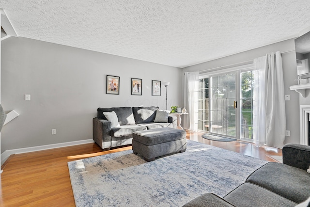 1814 Bennigan Dr Unit 88B, Hilliard, OH 43026 - living room with wood finished floors and a textured ceiling