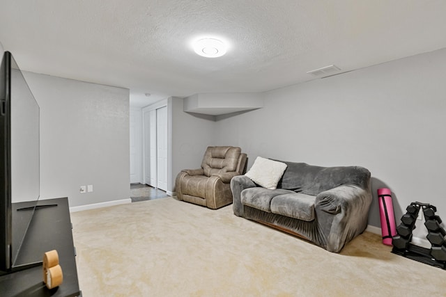 1814 Bennigan Dr Unit 88B, Hilliard, OH 43026 - carpeted living area featuring a textured ceiling