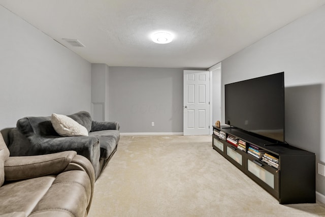 1814 Bennigan Dr Unit 88B, Hilliard, OH 43026 - living room featuring a textured ceiling and light colored carpet
