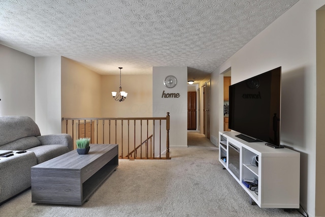 7805 Kiowa Way, Columbus, OH 43085 - living room with a chandelier, light carpet, and a textured ceiling