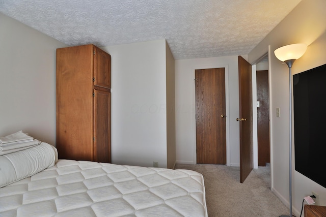 7805 Kiowa Way, Columbus, OH 43085 - bedroom with light colored carpet, a textured ceiling, and a closet