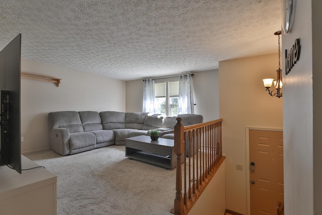 7805 Kiowa Way, Columbus, OH 43085 - living room featuring carpet flooring, a textured ceiling, and a chandelier