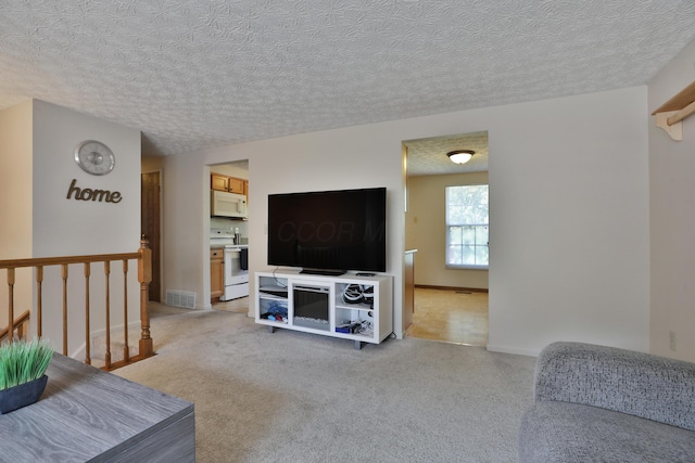 7805 Kiowa Way, Columbus, OH 43085 - living room featuring light colored carpet and a textured ceiling