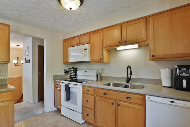 7805 Kiowa Way, Columbus, OH 43085 - kitchen with white appliances, light countertops, a chandelier, and brown cabinetry