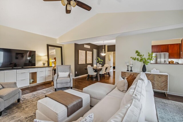 142 Blakemore Dr, Delaware, OH 43015 - living area featuring ceiling fan, vaulted ceiling, and dark wood-style flooring