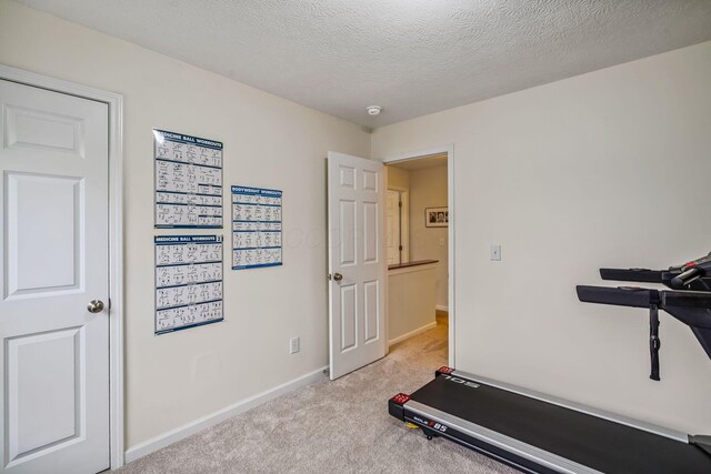 142 Blakemore Dr, Delaware, OH 43015 - exercise area with light colored carpet and a textured ceiling