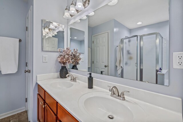 142 Blakemore Dr, Delaware, OH 43015 - bathroom featuring a shower stall, double vanity, and a chandelier