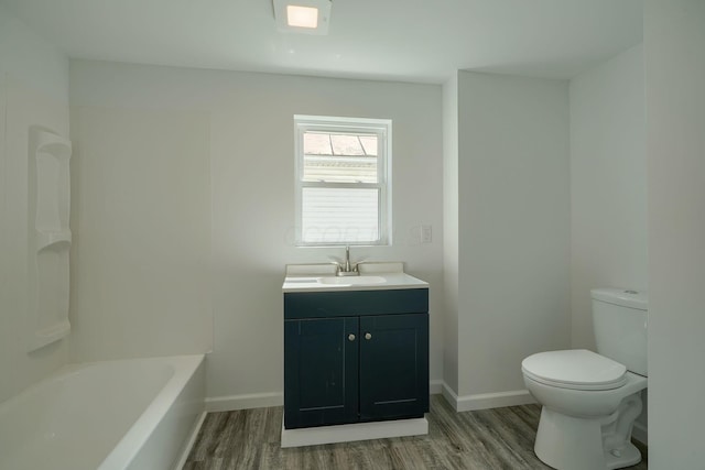 570 E Water St, Chillicothe, OH 45601 - full bathroom featuring wood finished floors, vanity, and  shower combination