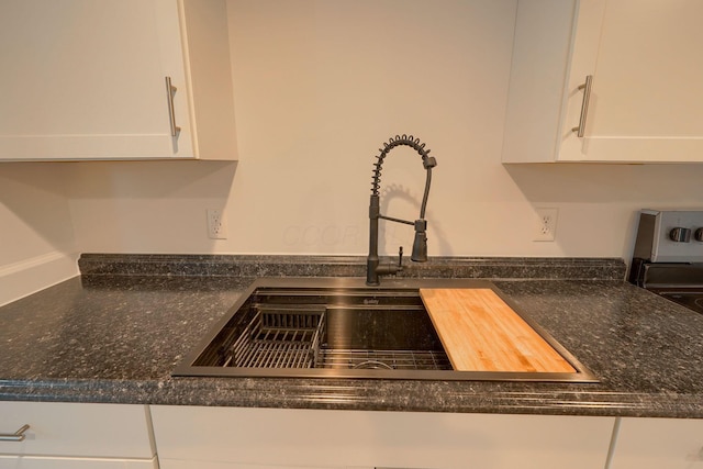 570 E Water St, Chillicothe, OH 45601 - kitchen view of white cabinets and dark stone counters