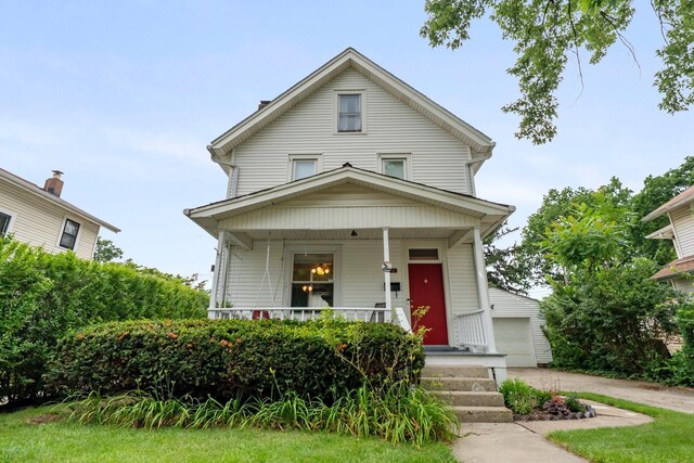116 W Longview Ave, Columbus, OH 43202 - traditional style home with covered porch, a garage, and an outbuilding