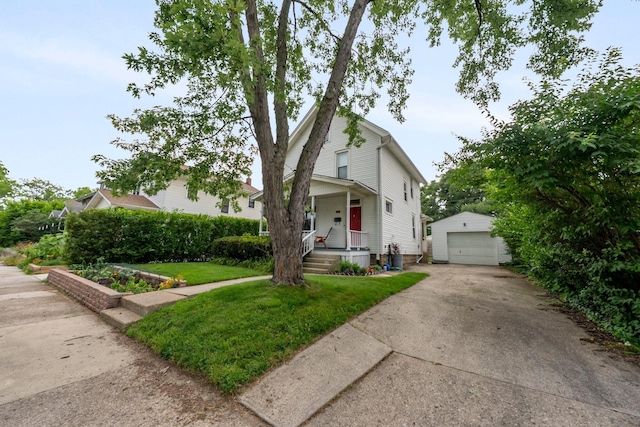 116 W Longview Ave, Columbus, OH 43202 - view of front of house featuring an outbuilding, concrete driveway, a detached garage, covered porch, and a front yard