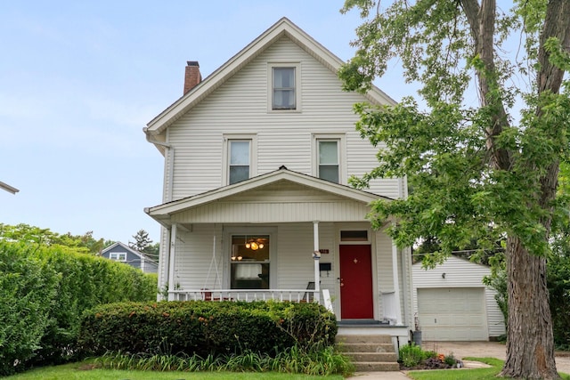 116 W Longview Ave, Columbus, OH 43202 - view of front facade featuring covered porch, a chimney, and a garage