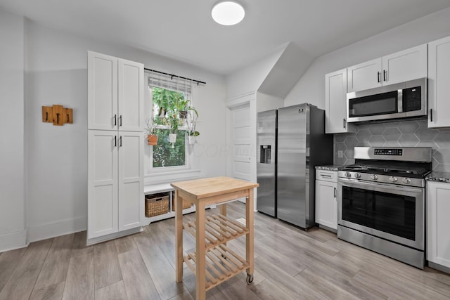 116 W Longview Ave, Columbus, OH 43202 - kitchen featuring stainless steel appliances, light wood finished floors, backsplash, and white cabinetry