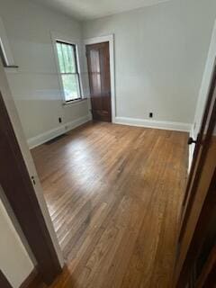 6607 Vandalia Ave, Cleveland, OH 44144 - unfurnished bedroom featuring wood finished floors
