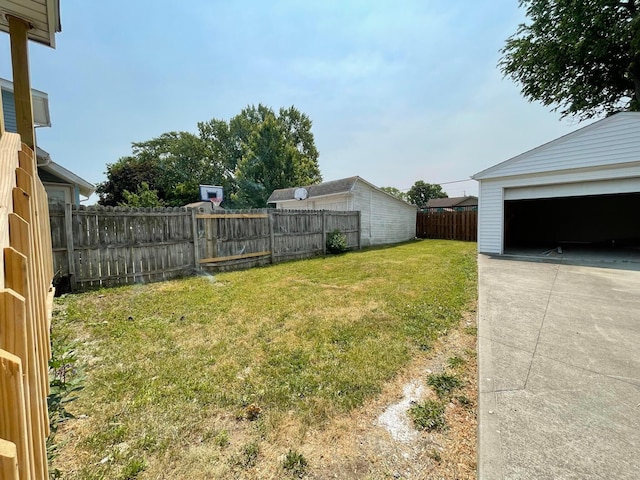 6607 Vandalia Ave, Cleveland, OH 44144 - fenced backyard featuring a garage