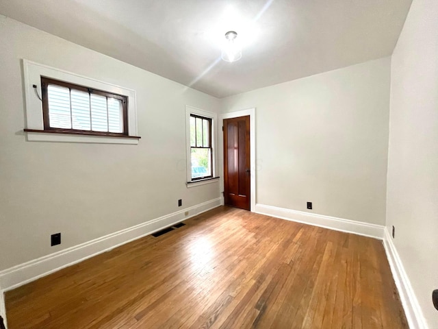 6607 Vandalia Ave, Cleveland, OH 44144 - empty room featuring baseboards and wood finished floors