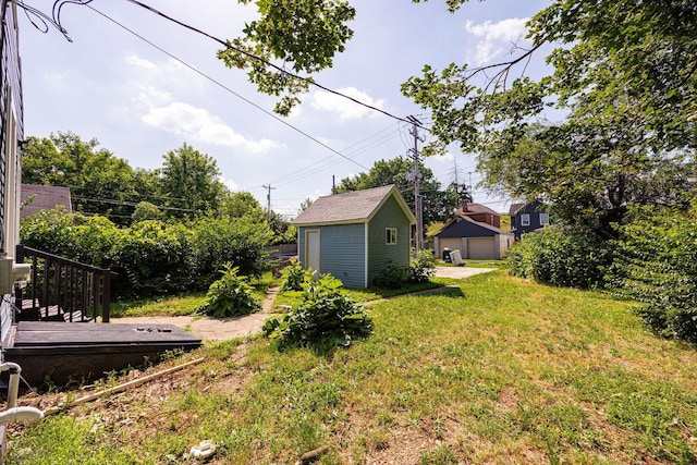 765 Campbell Ave, Columbus, OH 43222 - view of green lawn with a garage