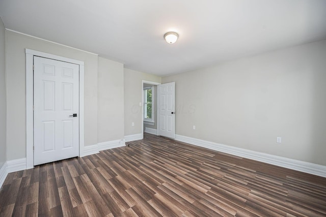 765 Campbell Ave, Columbus, OH 43222 - unfurnished bedroom featuring dark wood finished floors and baseboards