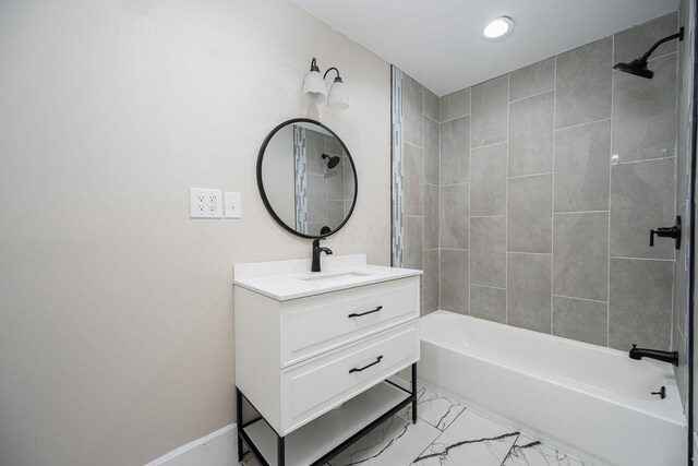 765 Campbell Ave, Columbus, OH 43222 - bathroom with vanity,  shower combination, marble look tile flooring, and recessed lighting