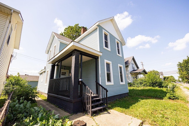 765 Campbell Ave, Columbus, OH 43222 - view of front facade with a chimney and a front lawn