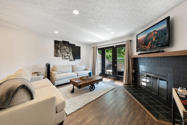 1768 Lake Meadow Dr Unit 1768H, Reynoldsburg, OH 43068 - living area with a textured ceiling, dark wood-type flooring, recessed lighting, and a fireplace
