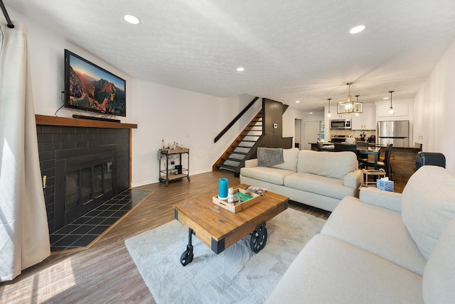 1768 Lake Meadow Dr Unit 1768H, Reynoldsburg, OH 43068 - living area featuring stairs, wood finished floors, a fireplace, and recessed lighting