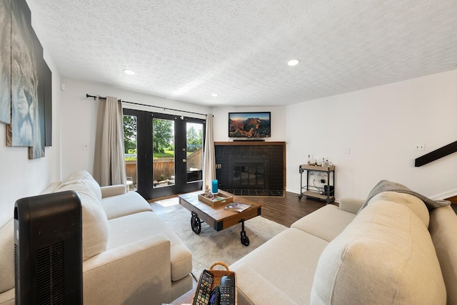 1768 Lake Meadow Dr Unit 1768H, Reynoldsburg, OH 43068 - living area featuring a textured ceiling, recessed lighting, wood finished floors, and a fireplace