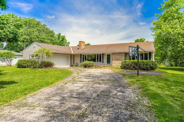 1282 Lawndale Rd, Marion, OH 43302 - view of front facade featuring driveway, a chimney, a front yard, and a garage
