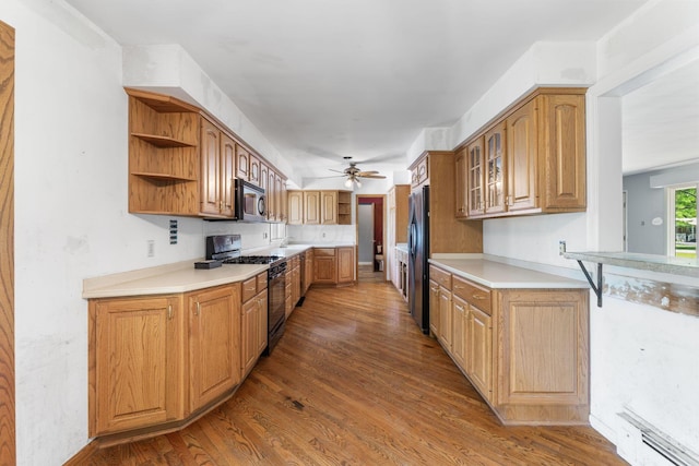 1282 Lawndale Rd, Marion, OH 43302 - kitchen with black range with gas stovetop, stainless steel microwave, open shelves, freestanding refrigerator, and a ceiling fan