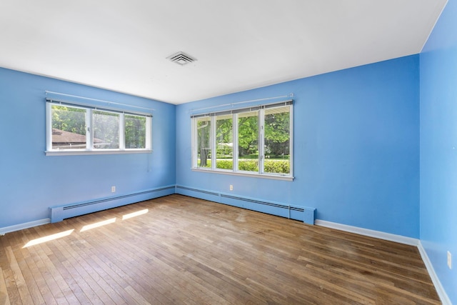 1282 Lawndale Rd, Marion, OH 43302 - spare room with a baseboard radiator and hardwood / wood-style floors
