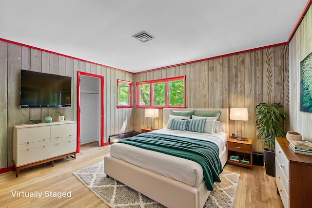 1282 Lawndale Rd, Marion, OH 43302 - bedroom featuring light wood-style flooring and wood walls