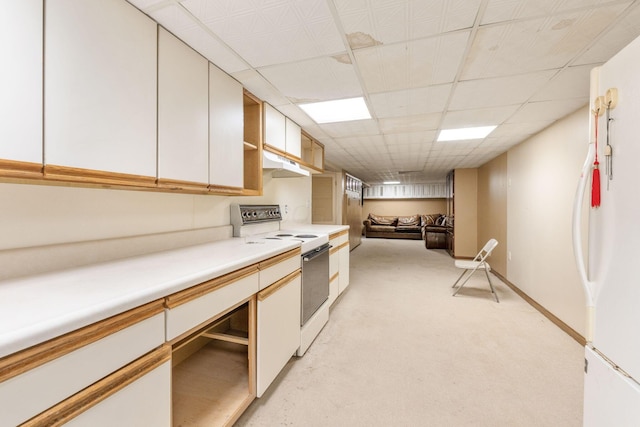 1282 Lawndale Rd, Marion, OH 43302 - kitchen featuring white appliances, under cabinet range hood, light countertops, a drop ceiling, and light colored carpet