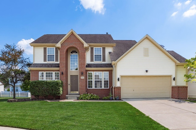 5899 Cove Point Ct, Columbus, OH 43228 - traditional-style home featuring driveway, a front lawn, and brick siding