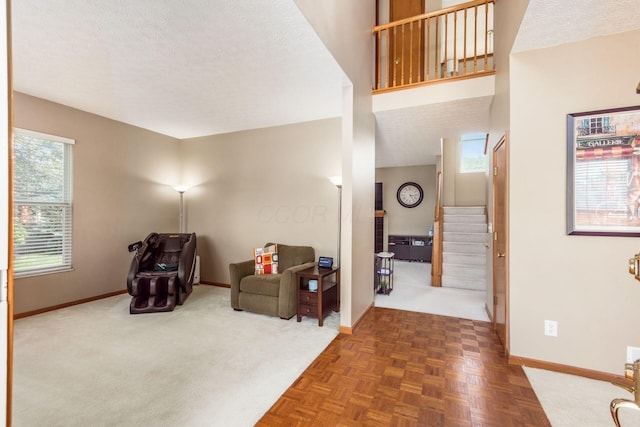 5899 Cove Point Ct, Columbus, OH 43228 - sitting room featuring stairway and a textured ceiling