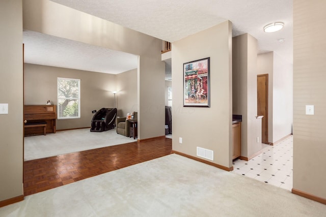 5899 Cove Point Ct, Columbus, OH 43228 - entryway featuring light colored carpet and a textured ceiling