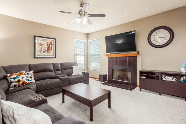 5899 Cove Point Ct, Columbus, OH 43228 - living room with carpet floors, a ceiling fan, and a fireplace