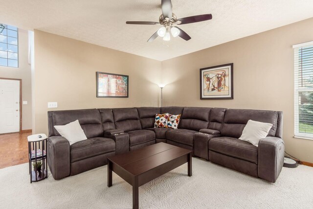 5899 Cove Point Ct, Columbus, OH 43228 - living area featuring healthy amount of natural light, ceiling fan, and light colored carpet