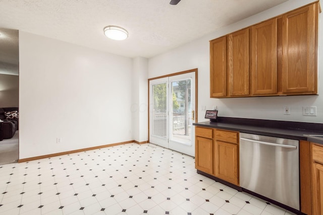 5899 Cove Point Ct, Columbus, OH 43228 - kitchen featuring stainless steel dishwasher, dark countertops, brown cabinets, and light floors