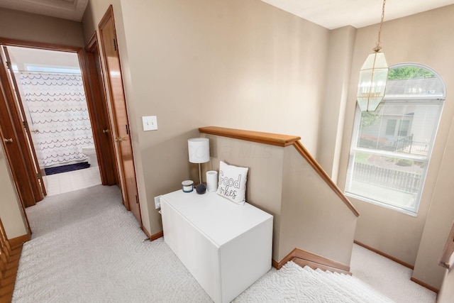5899 Cove Point Ct, Columbus, OH 43228 - corridor with an upstairs landing and light colored carpet