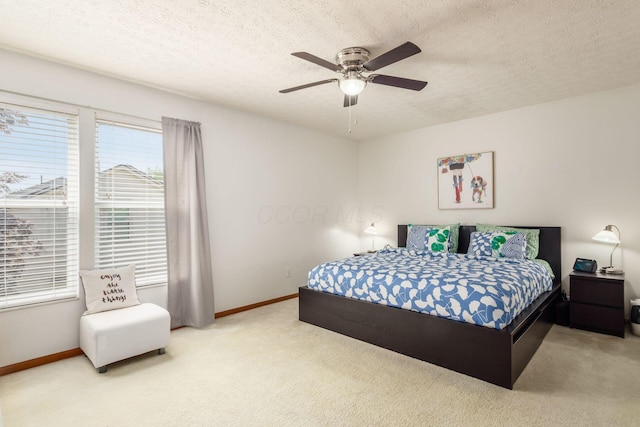 5899 Cove Point Ct, Columbus, OH 43228 - carpeted bedroom featuring a textured ceiling and a ceiling fan
